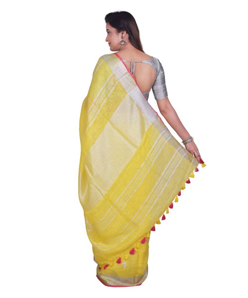 Handcrafted Yellow Linen saree with Silver zari border and beautiful embroidery work