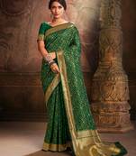 Green woven banarasi silk saree with blouse
