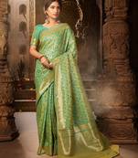 Light green woven banarasi silk saree with blouse