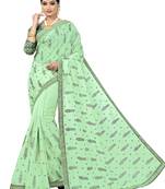Green embroidered tissue saree with blouse