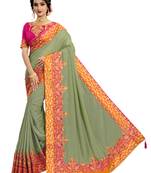 Green embroidered pure silk saree with blouse
