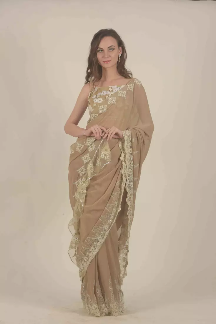 Rina Dhaka beige georgette saree with all over lace work detail border ruffle detail in palla