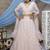 Peach Thread and Sequis=embroidered net Semi Stitched bridal lehenga
