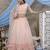 Peach Thread and sequence Embroidered with all over pearl rivet stud pasting net Semi Stitched bridal lehenga