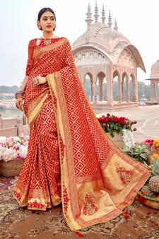 Red woven silk blend saree with blouse