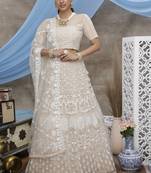 beguiling Beige Thread and Sequins embroidered net semi stitched Party lehenga