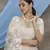 Beige embroidered net Semi Stitched bridal lehenga