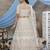 beguiling Beige Thread and Sequins embroidered net semi stitched Party lehenga