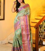 Light green woven silk blend saree with blouse