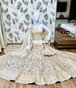 Peach embroidered satin semi stitched bridal lehengas