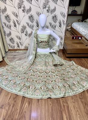 Green embroidered satin semi stitched bridal lehengas 1