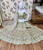 Green embroidered satin semi stitched bridal lehengas