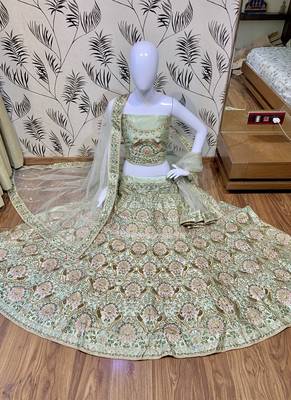 Green embroidered satin semi stitched bridal lehengas 2