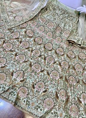 Green embroidered satin semi stitched bridal lehengas 4