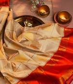 Cream woven kanchipuram silk saree with blouse