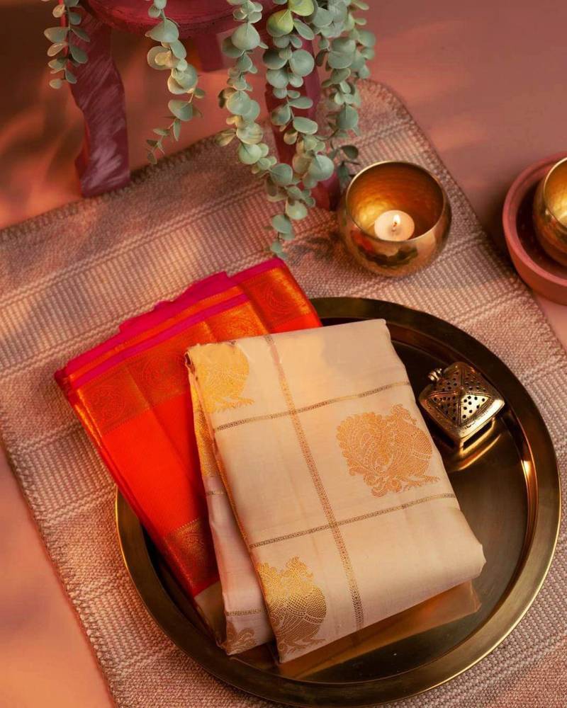 Cream woven kanchipuram silk saree with blouse