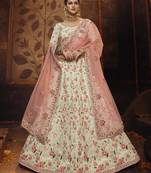 Mesmerizing Off-white colored gota, zarkan, thread and dori embroidered georgette fabric wedding Lehenga for bride