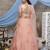 Orange thread and sequins embroidered net semi-stitched lehenga