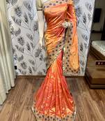 Orange embroidered pure raw silk saree with blouse