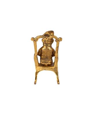 Lord Ganesha Statue Sitting on A Chair and Reading Ramayan 2