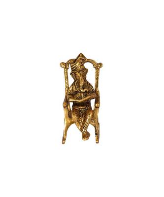 Lord Ganesha Statue Sitting on A Chair and Reading Ramayan 1