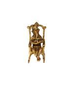 Lord Ganesha Statue Sitting on A Chair and Reading Ramayan