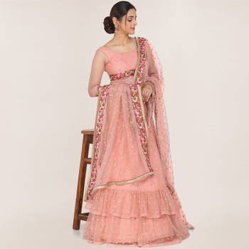 Peach embroidered net semi stitched lehenga 1
