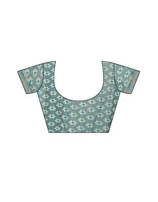 Teal woven lycra saree with blouse 4