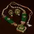 Kundan, Pearls and Green Beads Embellished Designer Necklace Set 317FNN184