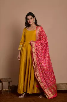 Tangerine yellow anarkali with peach gharchola dupatta