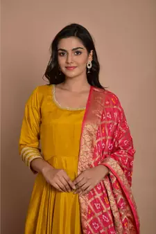 Tangerine yellow anarkali with peach gharchola dupatta
