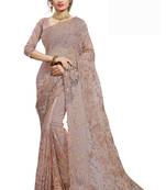 Beige embroidered net saree with blouse