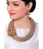 Festive Necklace Set With Gold Toned Temple Broach & Jute