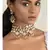 Pristine Enamelled Red And Off White Kundan Necklace And Earring Set