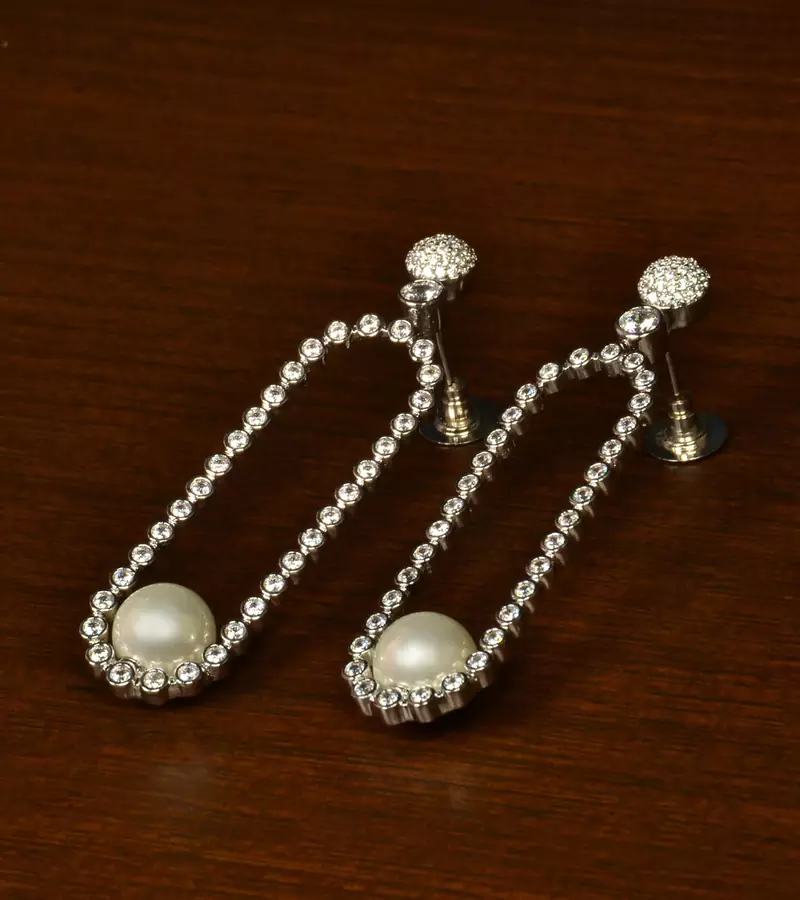 Rhodium Plated Pearl and American Diamond Embellished Dangler 216ED349