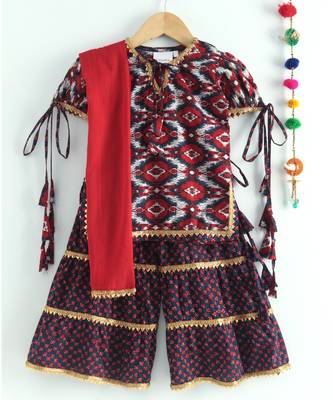 ikkat print red kurti with a dotted black and red triple layered sharara and red dupatta 4