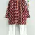 red ikkat print kurta with a white pajama