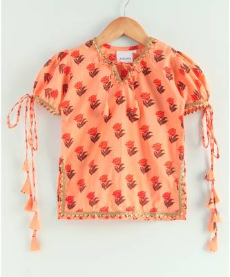 floral peach kurti with a triple layered sharara and a red dupatta 2