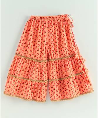 floral peach kurti with a triple layered sharara and a red dupatta 5