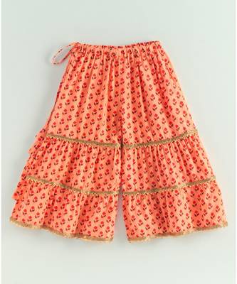 floral peach kurti with a triple layered sharara and a red dupatta 6