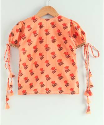 floral peach kurti with a triple layered sharara and a red dupatta 7