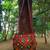 Real Mirror Worked Matka Shaped Kutch Embroidered Banjara Jhola Bag With Multicolored Pompoms All Around