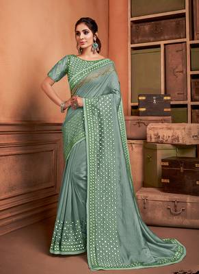 Green embroidered silk blend saree  1