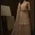 Beige sequins embroidered net sharara suit