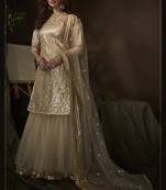 Bewitching Beige sequins embroidered net fabric sharara suit