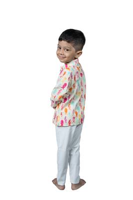 fish print with wooden buttons and white patiala 3