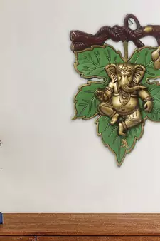 eCraftIndia Dancing Golden Lord Ganesha  on Green Leaf Metal Wall Hanging