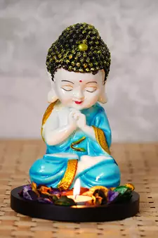 eCraftIndia Praying Blue Monk Buddha with Wooden Base, Fragranced Petals and Tealight