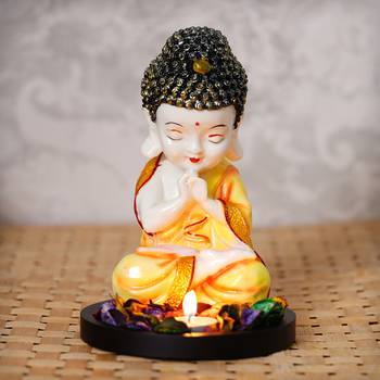 eCraftIndia Praying Orange Monk Buddha with Wooden Base, Fragranced Petals and Tealight 1