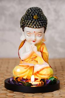 eCraftIndia Praying Orange Monk Buddha with Wooden Base, Fragranced Petals and Tealight